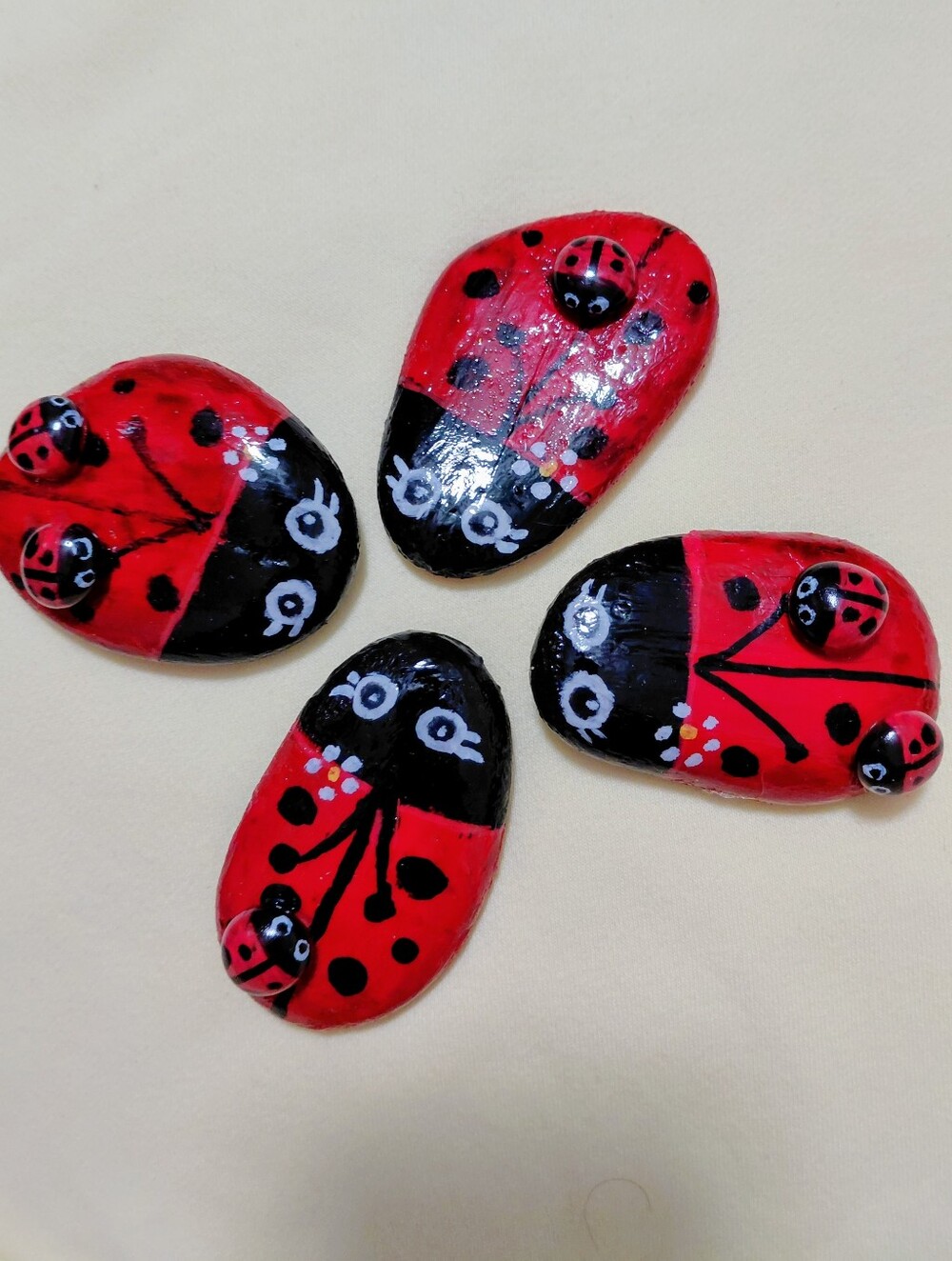 Hand-Painted Ladybugs With There Babies On Stones Aprox 2x3"